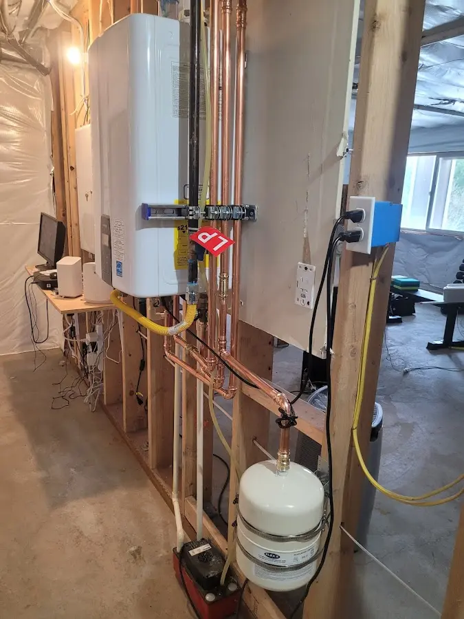 Licensed plumber repairing a kitchen sink in Ledyard